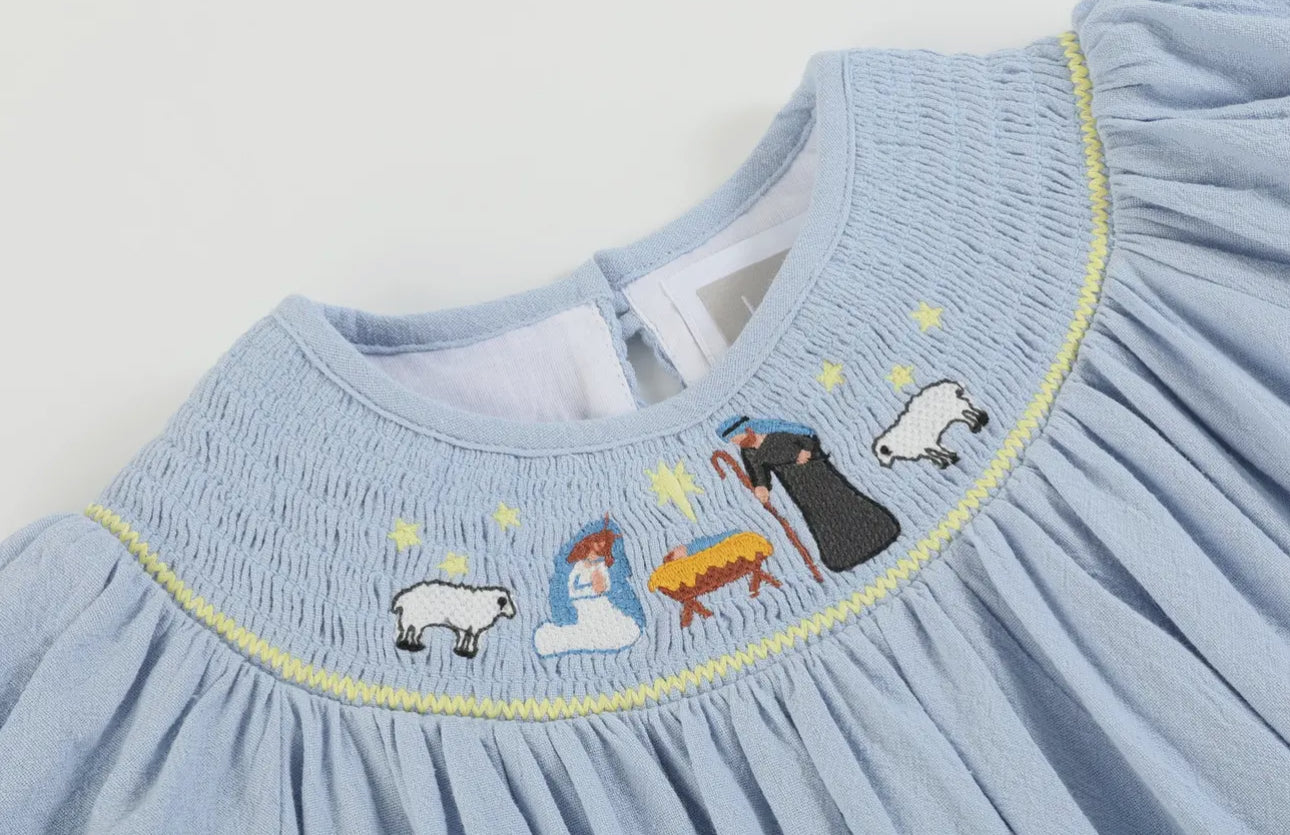 Light Blue Nativity Smocked Bishop
Sleeve Dress